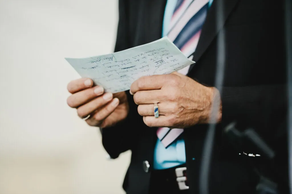 Man reviewing immigration paperwork, seeking ministerial intervention.