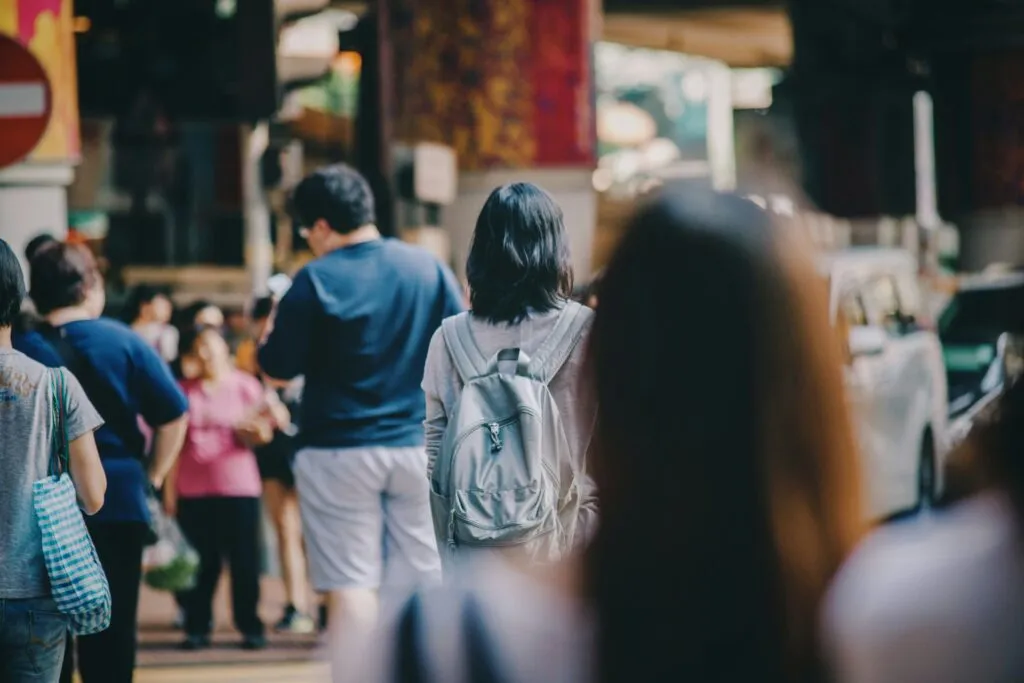 People walking on a busy city street.