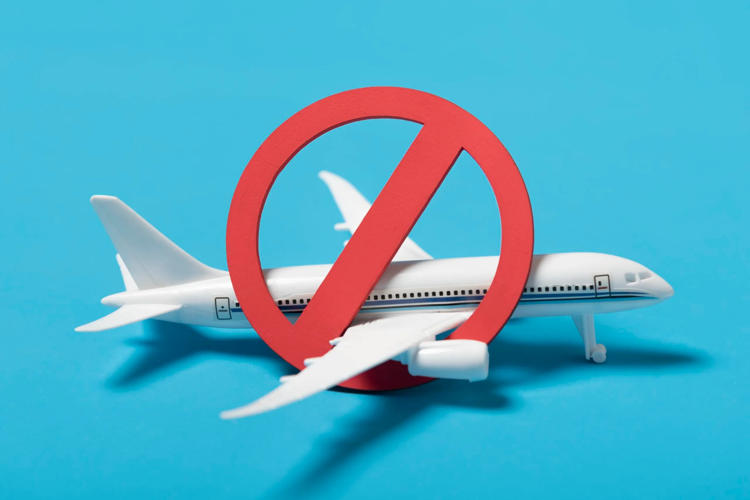 Airplane with a red prohibition sign. Possible illustration for Section 109 visa cancellation.