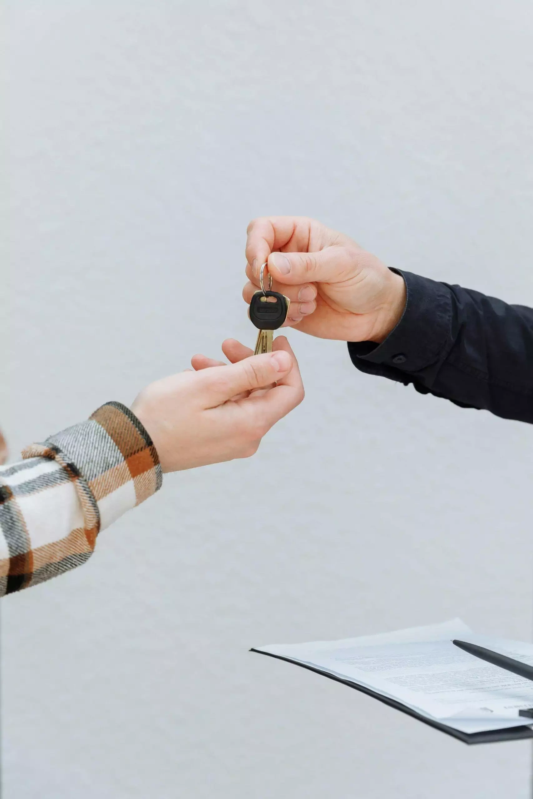 Handing over house keys, symbolizing Australian not-for-profit legal structure setup.