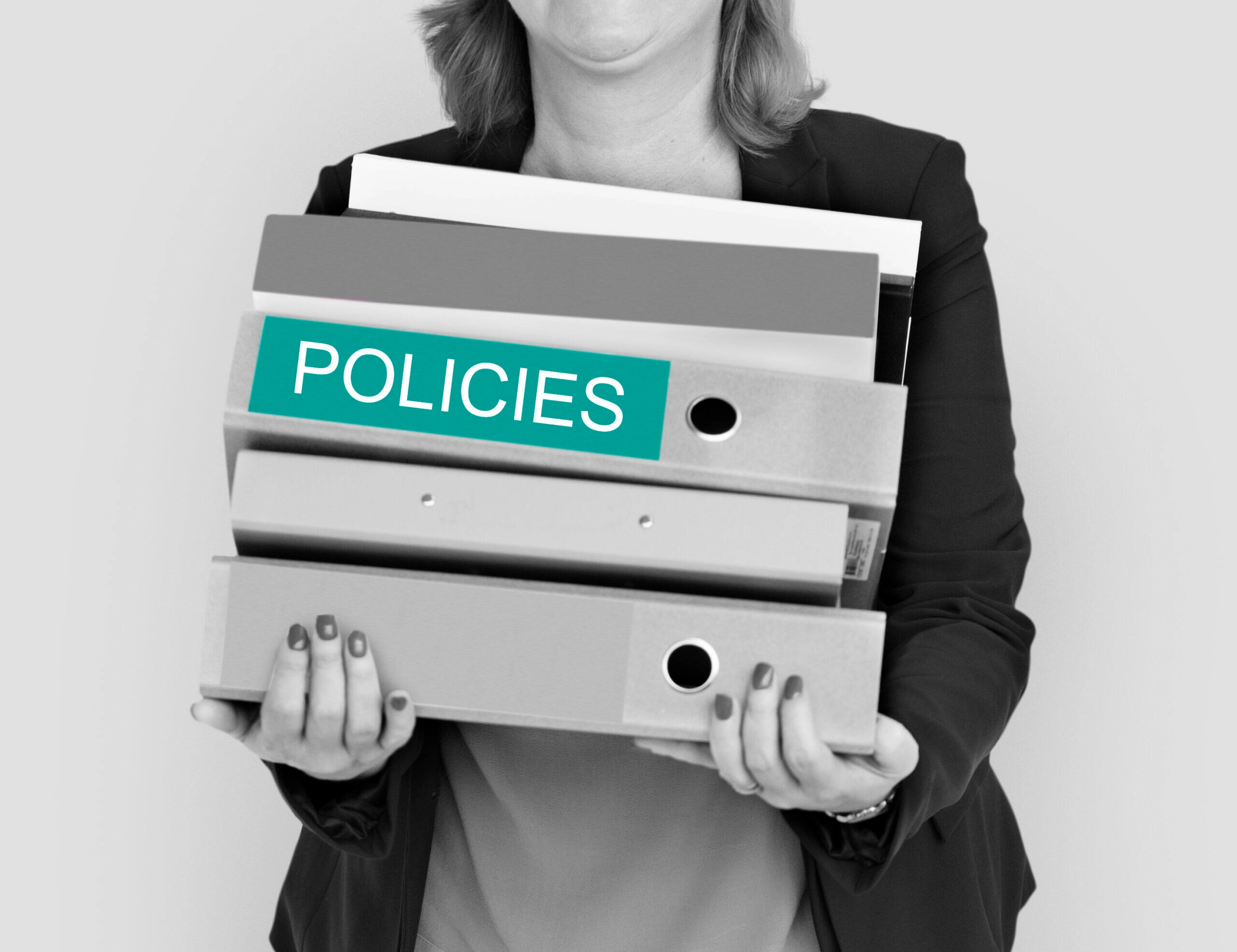 Woman holding files labeled